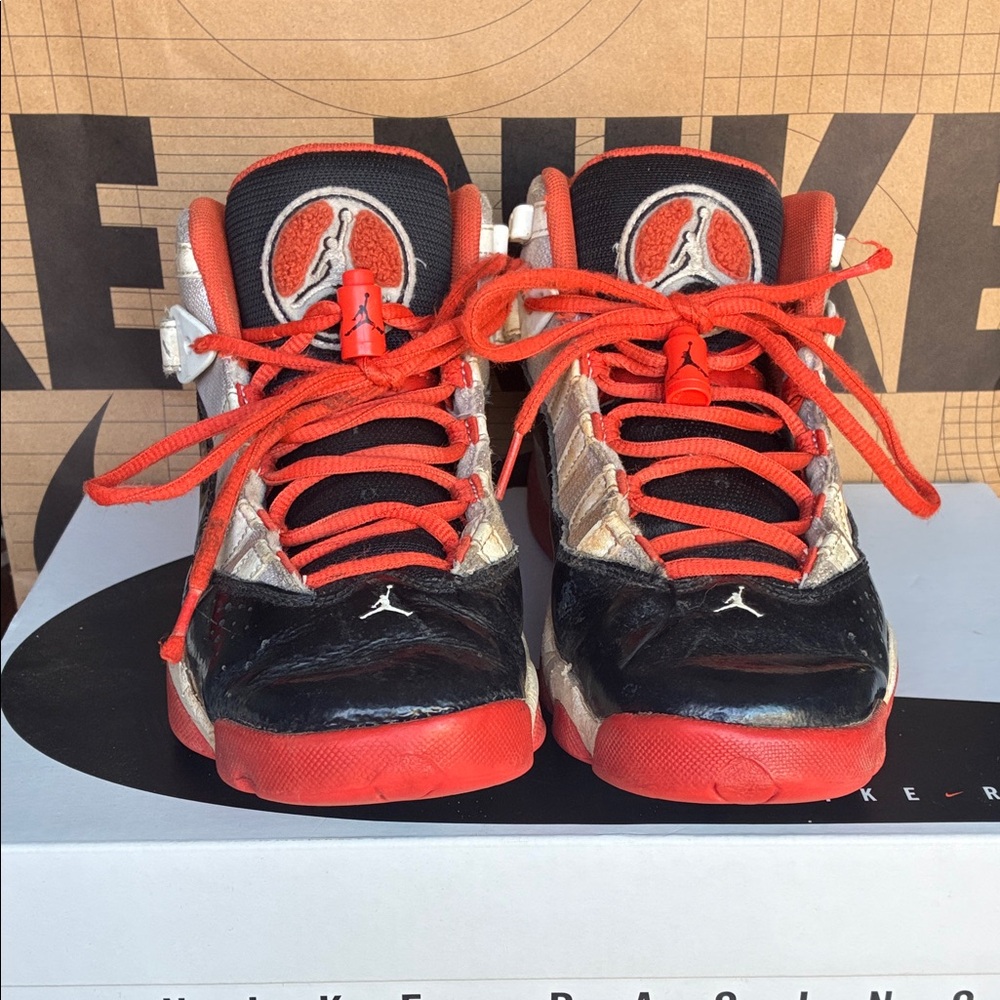 Nike Kids Black and Orange Jordan Sneakers